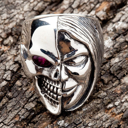 A sterling silver skull ring with a single red eye, part of the two-face Memento Mori design.