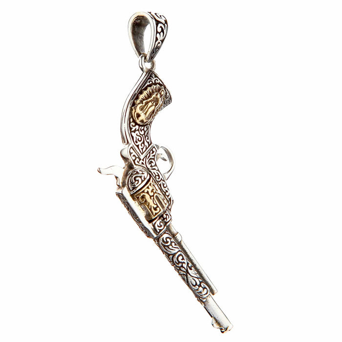 A men's vintage revolver pendant with intricate Western-style hand engraving.