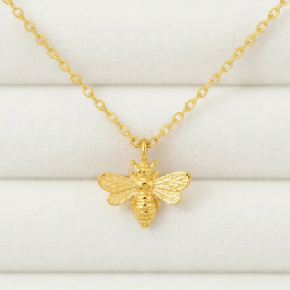 Mini bee gold pendant necklace with detailed wings on dainty chain