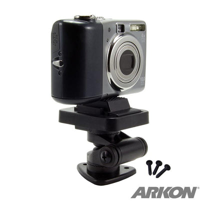 A digital camera is mounted on the Multi-Angle Adhesive or Drill Base Mount with a 1/4-20 camera mounting pattern in black, accompanied by three screws. The ARKON logo is visible in the bottom right corner.