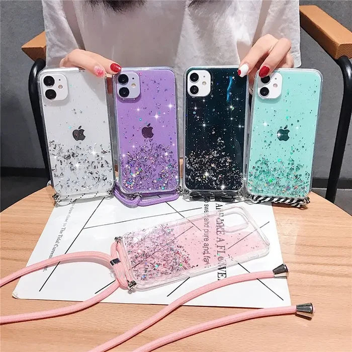 a woman holding a phone case with glitter and glitter