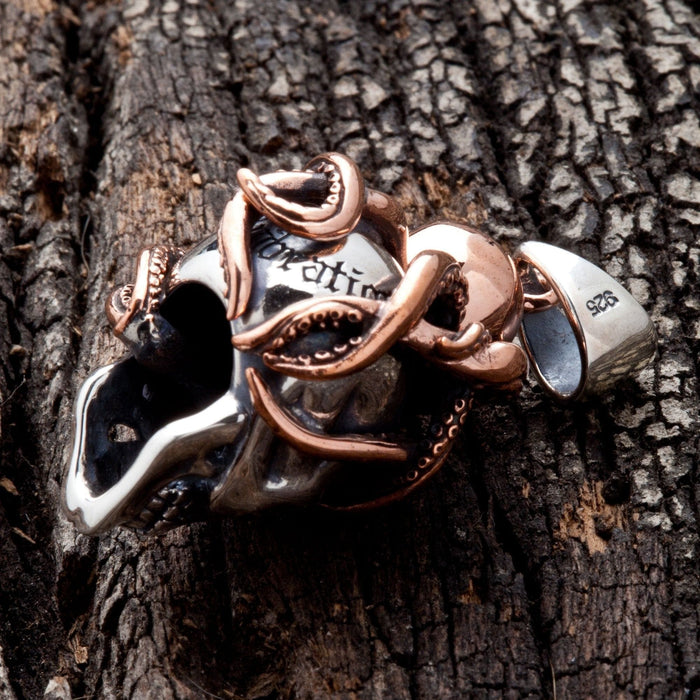 The back of the octopus skull pendant, showing the unique engravings and the .925 sterling silver stamp.
