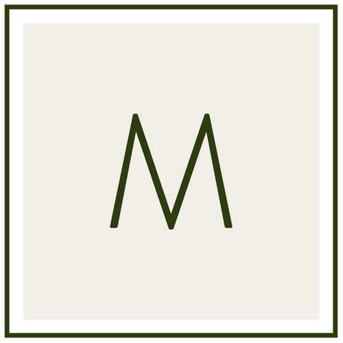 Monogram M in dark green on a pale beige background