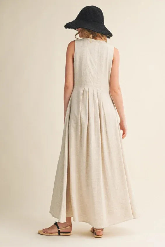 Cream linen maxi dress with pleated back, button front and side slit