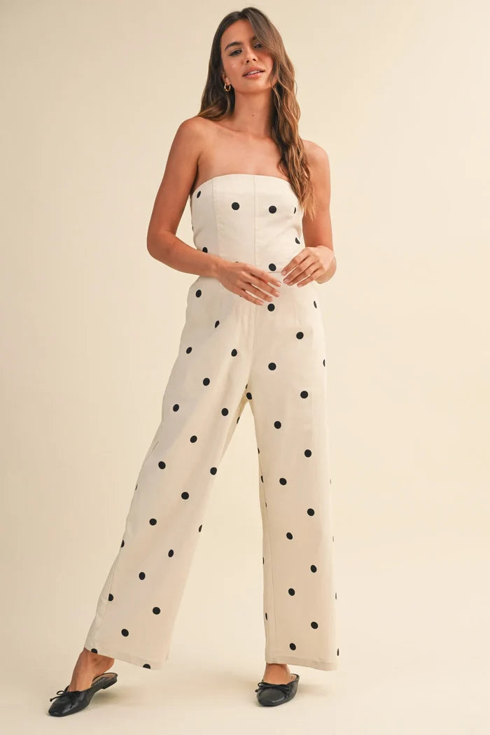 Off-white strapless polka dot stretch twill jumpsuit with fitted bodice and wide leg design