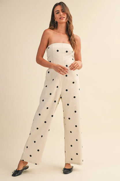 Off-white strapless polka dot stretch twill jumpsuit with fitted bodice and wide leg design