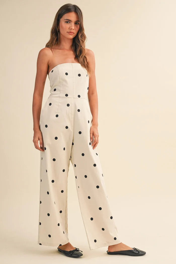 Cream-colored strapless wide leg jumpsuit with black polka dots made of polka dot stretch twill fabric