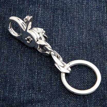Side profile of handcrafted silver skull keychain mechanism