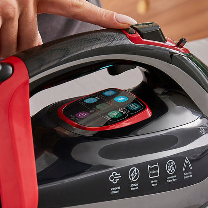 lady adjusting the settings on a steam iron