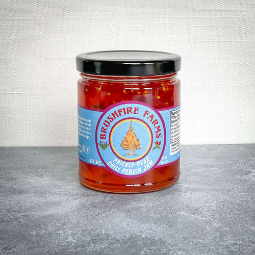 Brushfire Farms Prickly Pear Chili Pequin Jam from San Antonio, TX on a table.
