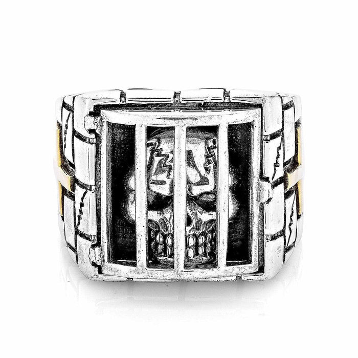 A direct front view of the prisoner skull ring, showing the fine detail of the skull behind the bars.