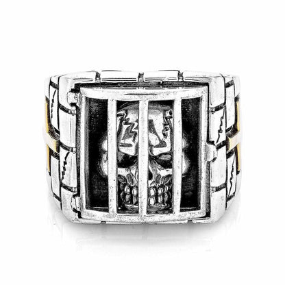 A direct front view of the prisoner skull ring, showing the fine detail of the skull behind the bars.