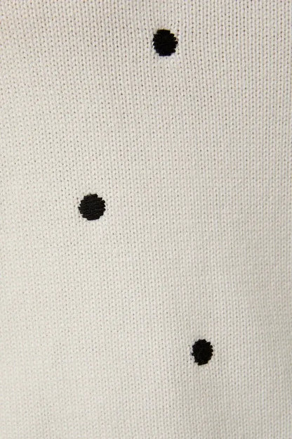Puff short sleeve polka dot sweater with white fabric and black embroidered dots