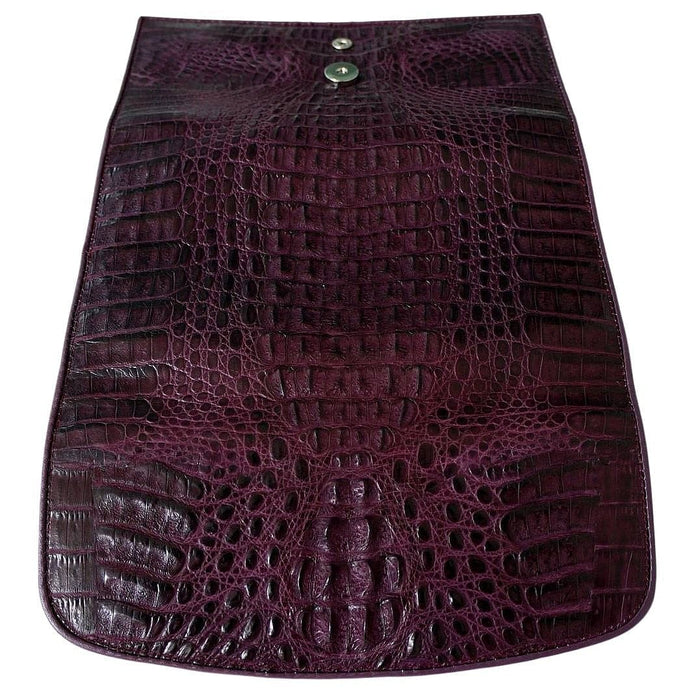 Rear exterior of the purple crocodile trifold wallet with snap stud and tapered hornback texture