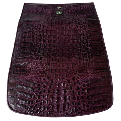 Rear exterior of the purple crocodile trifold wallet with snap stud and tapered hornback texture
