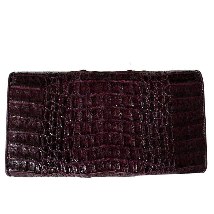 Top-down view of the closed purple crocodile wallet showing smooth scale rows across the body