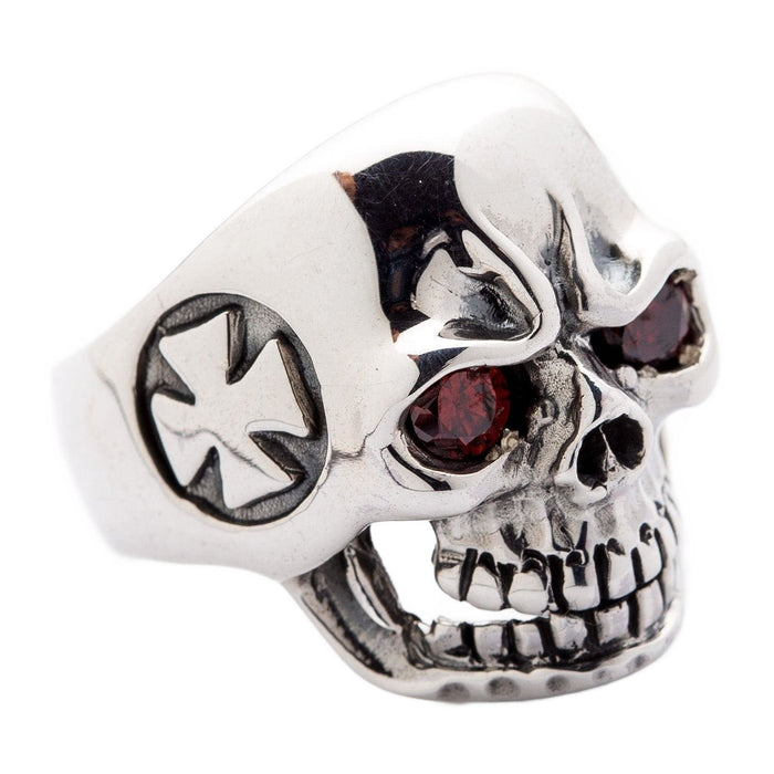 Close-up of a silver skull ring showing the Iron Cross emblem carved on the side temple.