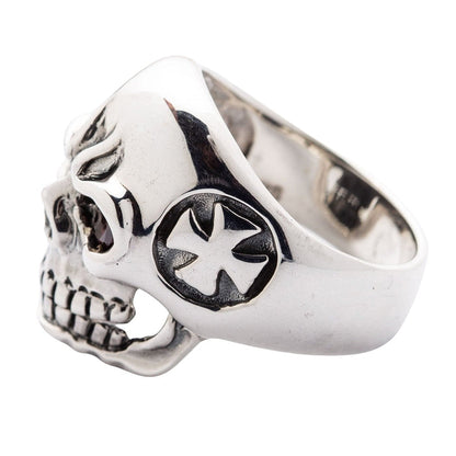 Side profile view of a heavy biker ring revealing the raised cross symbol and the depth of the sterling silver skull design.