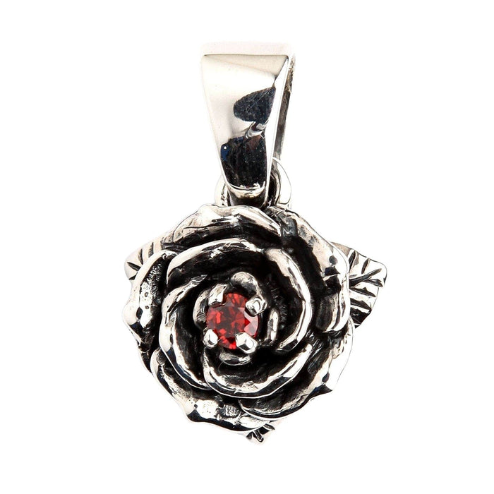 Sterling silver rose pendant with a red garnet stone at its center, shown against a clean white background.