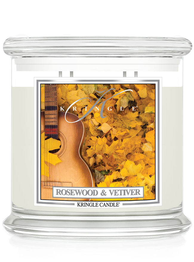 Unlit XL 4-wick candle labeled "Rosewood & Vetiver" with an image of a guitar surrounded by yellow leaves.
