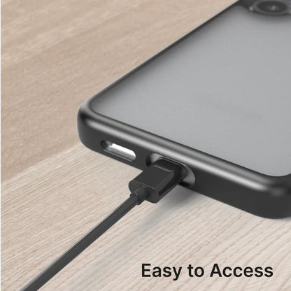 A close-up of a Samsung Galaxy S25 in the Catalyst Case US Impact Protection Case (Pre-Order) shows a charging cable plugged in on a wooden surface with "Easy to Access"—ideal for charging and protection.