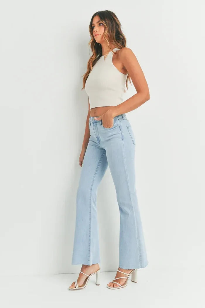 Woman in light blue flared jeans from HR SCISSOR CUT FLARE DENIM, shop Daisy now