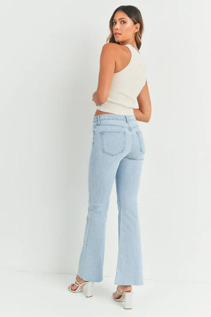 Woman in light blue flare jeans from HR SCISSOR CUT FLARE DENIM, part of women’s boho chic clothing