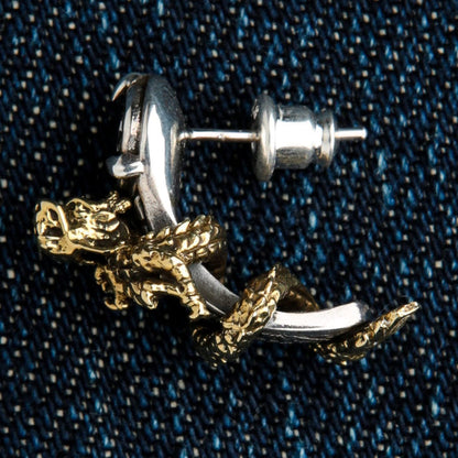 A single dragon stud earring with a black stone, a unique piece of men's fantasy jewelry.