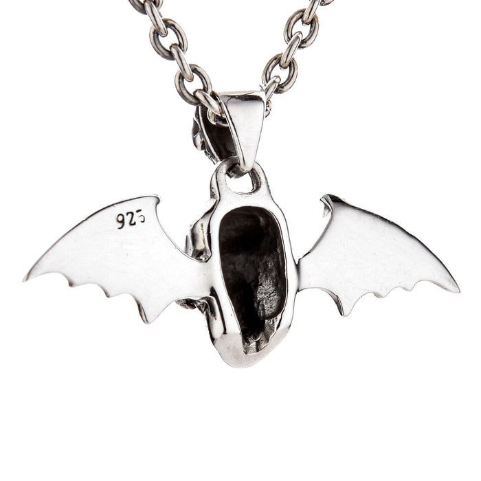 The back view of the winged skull pendant, showing its hollow construction and the .925 sterling silver stamp.