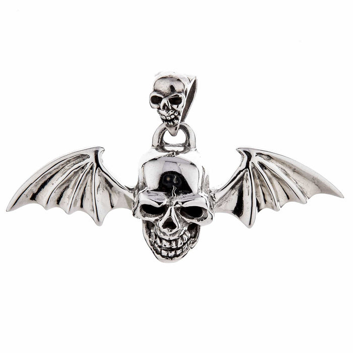 A gothic vampire skull pendant with detailed bat wings, isolated on a white background.