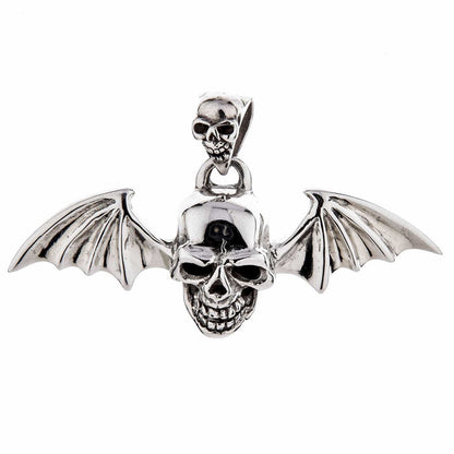 A gothic vampire skull pendant with detailed bat wings, isolated on a white background.
