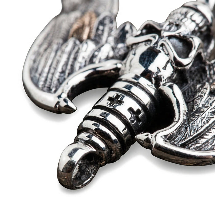 Extreme close-up of the lower spark plug section, detailing the ribbed silver texture, cross motifs, and bottom ring.