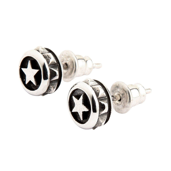 A side profile view of the biker-style silver stud earrings, showing the post and butterfly back.