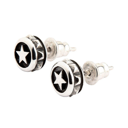 A side profile view of the biker-style silver stud earrings, showing the post and butterfly back.