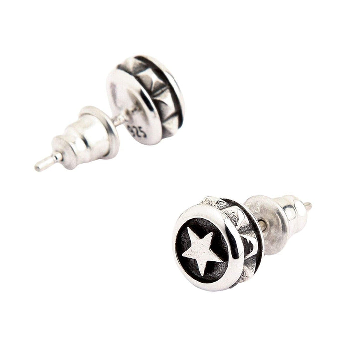 A clear shot of the unisex 925 silver star studs with a dark oxidized background for contrast.