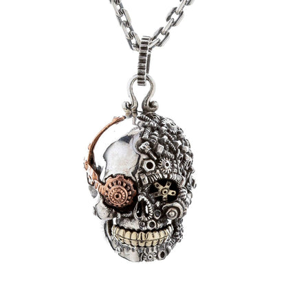 Front view of the sterling silver steampunk skull pendant with brass gear details