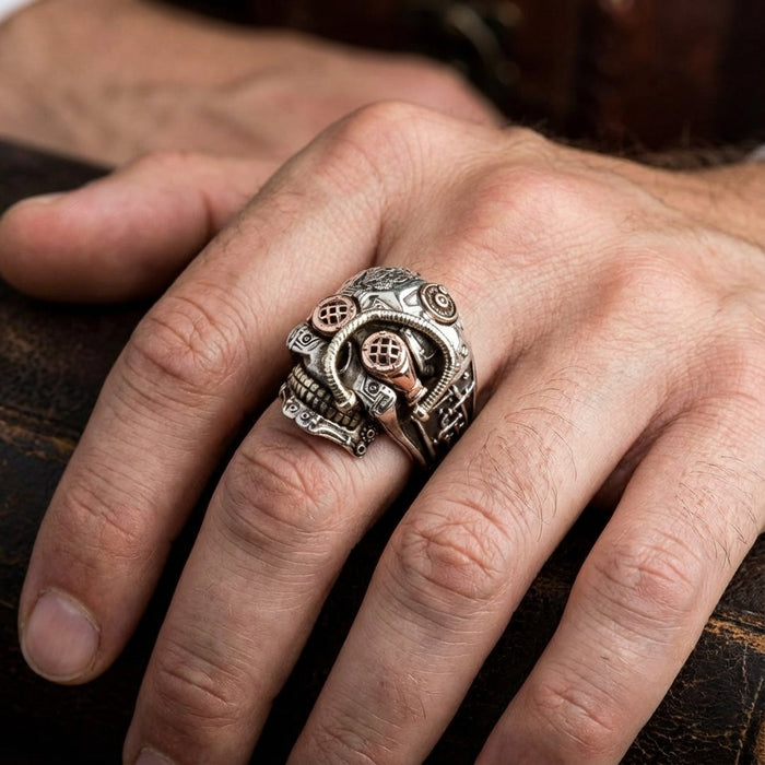 Model wearing a Sterling Silver Steampunk Skull Ring featuring mechanical gear details on finger, showcasing heavy biker jewelry style.