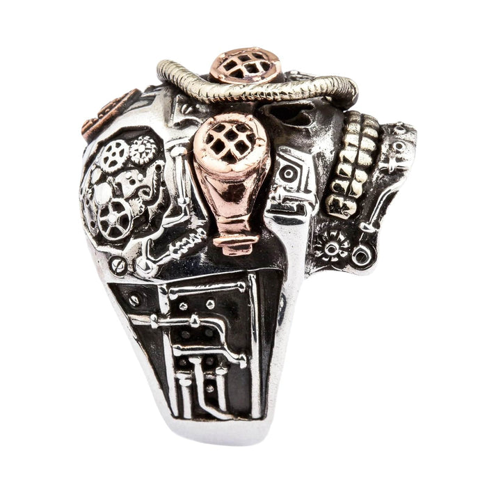 A bold piece of steampunk jewelry, the mechanical skull ring with gears and goggles.