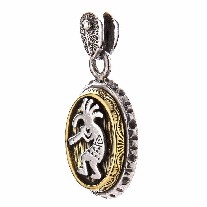 Side profile of the sterling silver and brass Kokopelli pendant, emphasizing its thickness and craftsmanship.