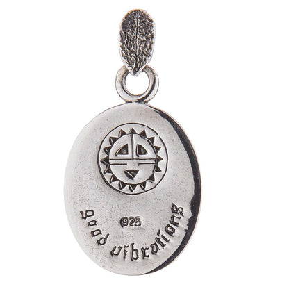 Back view of the pendant displaying the Native American Sun Symbol engraving.