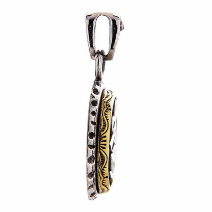 A side profile view of the two-tone Kokopelli pendant, showing its 4mm thickness.