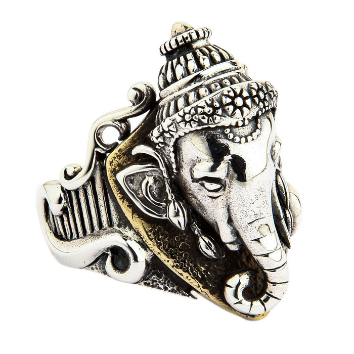 Side view of the Ganesh ring highlighting the detailed silver band and brass background.