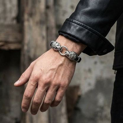 Man wearing sterling silver lion head leather bracelet with black leather jacket sleeve