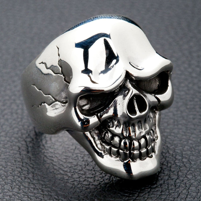 A side profile of the massive polished silver skull ring, highlighting its clean, powerful lines.