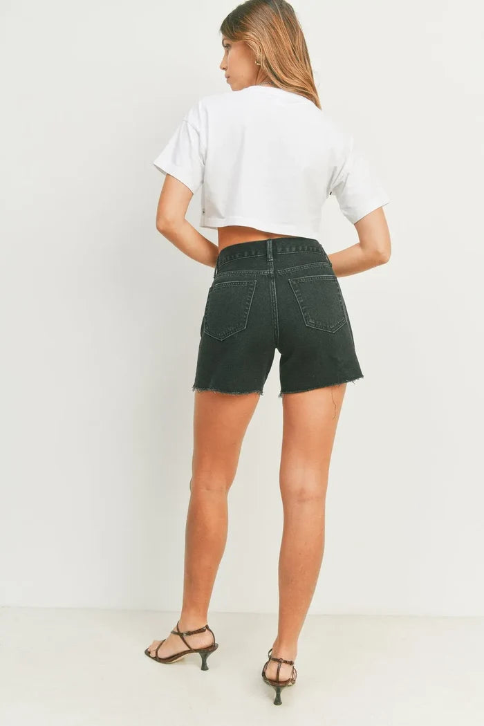 Woman wearing black denim shorts from SUMMER BOYFRIEND SHORT, perfect for womens boho clothes