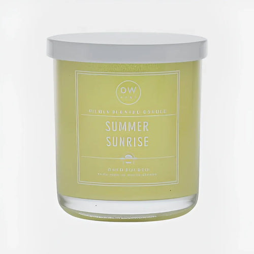 Scented candle in a glass jar with pale yellow label for Summer Sunrise Candle boho decor