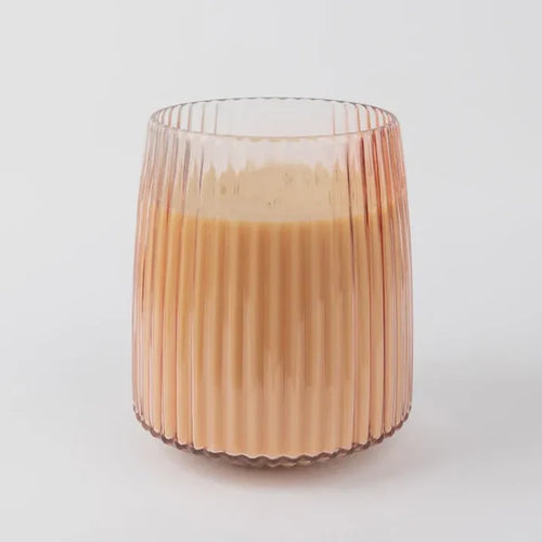 Ribbed glass tumbler with creamy orange sparkling tea in Sweet Grace Jumbo Candle