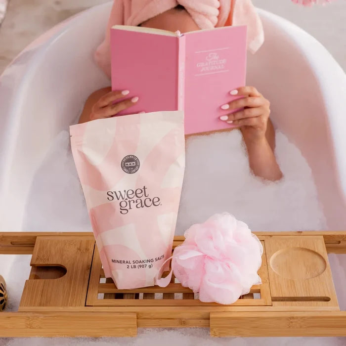 Pink sweet grace soaking salts bag with geometric pattern and white text for relaxing mineral soak use