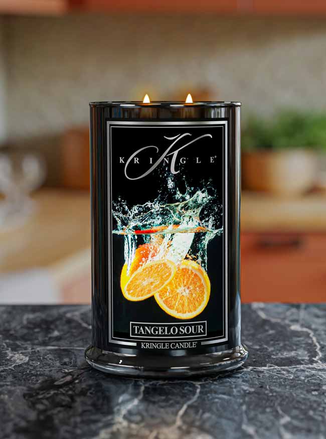 Kringle Candle with tangelo sour design on a dark surface