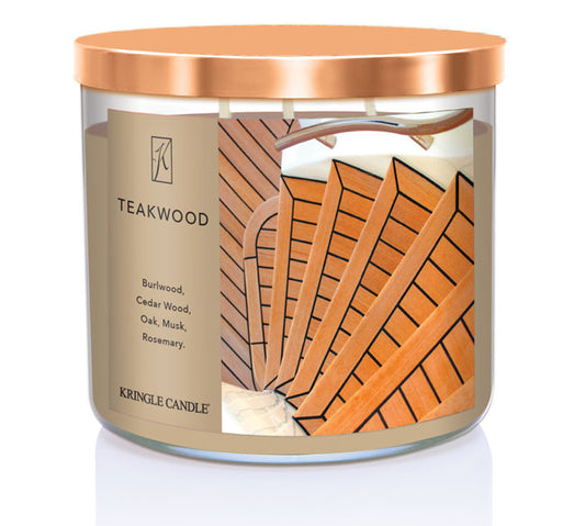 A three-wick candle in a clear glass jar with a black lid and a sophisticated wood-themed label. The label features a polished teakwood surface with an elegant woodgrain pattern. The candle’s wax is rich brown, and the wicks are unlit. The scent notes listed are burlwood, cedarwood, oak, musk, and rosemary.